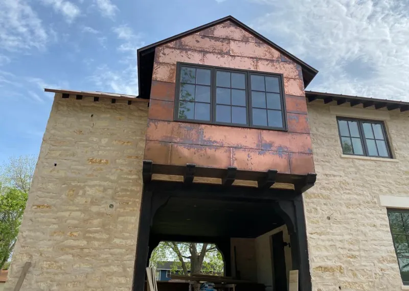 Copper metal panel facade on a stone building for Metal Roof Coating in Lakeland North